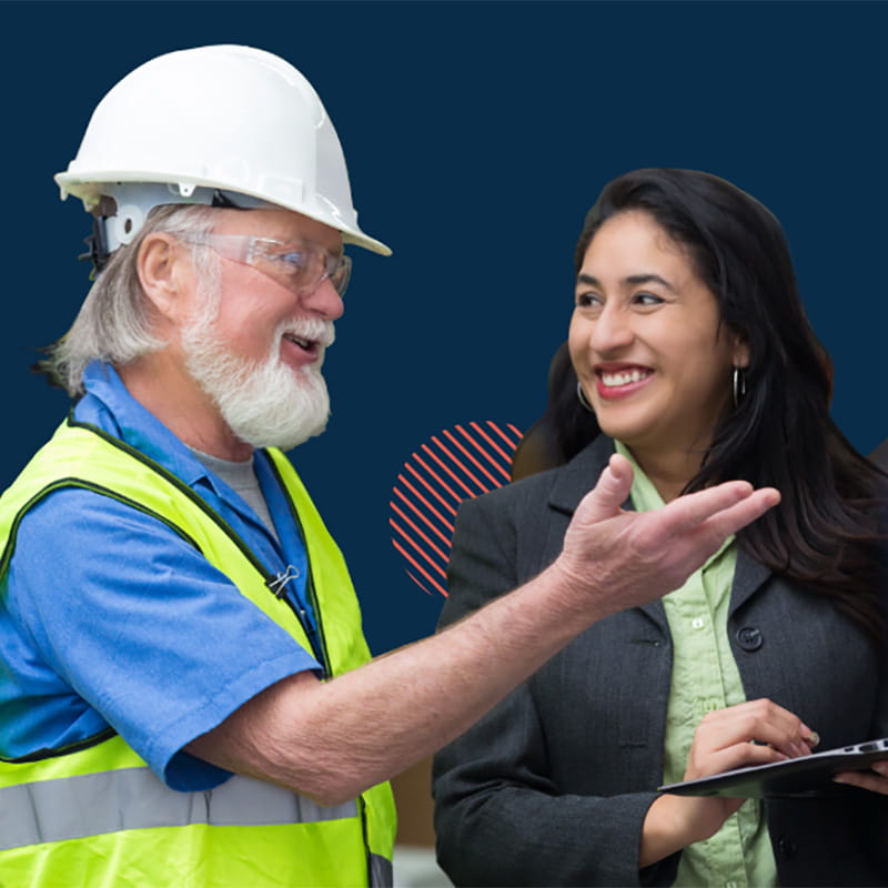 Man in hard hat talking with woman